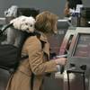 Photo: Corie Geller checks in for her flight to Kansas Ci Photo: Corie Geller checks in for her flight to Kansas Ci
