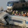 Photo: An Amtrak train, top, traveling on an unaffected t Photo: An Amtrak train, top, traveling on an unaffected t
