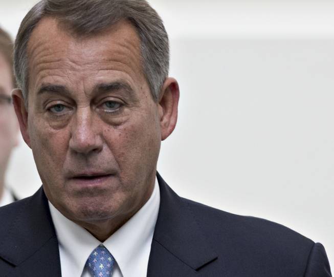 House Speaker John Boehner of Ohio arrives for a closed-door strategy session with House GOP leaders on Capitol Hill in Washington, Tuesday, Dec. 3, 2013. Congress is racing toward renewing a 25-year-old prohibition against firearms that can evade metal detectors and X-ray machines, just days before the ban expires. The Republican-led House was expected to approve a 10-year extension of the ban on Tuesday.