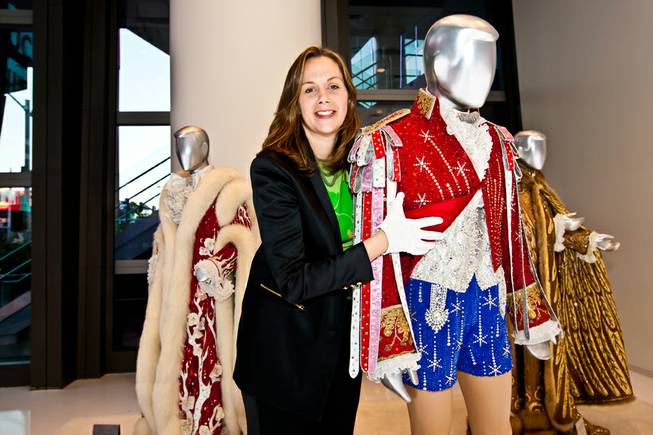 Curator Deirdre Clemente, PhD, shows the intricate designs of Liberace's rhinestone Red, White and Blue hot pants ensemble while giving a walk-through of the Liberace Exhibition at the Cosmopolitan in Las Vegas Deceber 6, 2013. Clemente is assistant professor of history and associate director of the public history program at the University of Nevada, Las Vegas. She also served as historical consultant for Buz Luhrmanns The Great Gatsby.