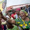 Photo: Mourners sing and dance to celebrate the life of N Photo: Mourners sing and dance to celebrate the life of N