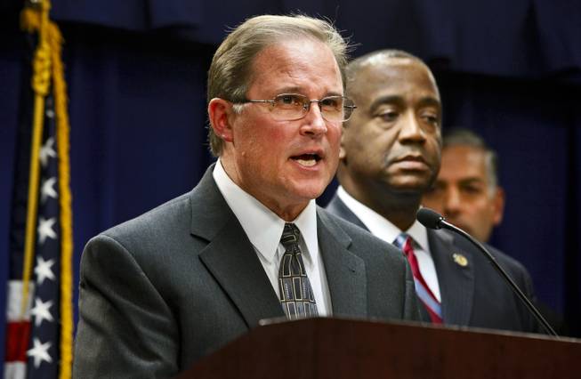 Bill Lewis, assistant director in charge of the FBI’s Los Angeles Division, left, with Andre Birotte, U.S. Attorney for the Central District of California, comment on the five criminal cases filed against 18 current and former Los Angeles County sheriff’s deputies as part of an FBI investigation into allegations of civil rights abuses and corruption in the nation’s largest jail system, during a news conference in Los Angeles, Monday, Dec. 9, 2013.