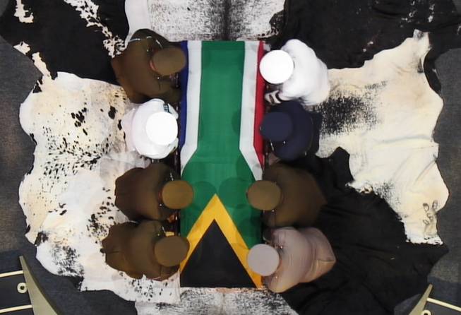 In this video frame grab, military officers prepare to lift South African President Nelson Mandela's casket following his funeral service in Qunu, South Africa, on Sunday, Dec. 15, 2013.