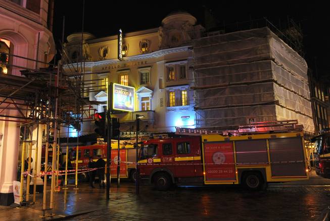 Emergency services attend the scene at the Apollo Theatre in Shaftesbury Avenue, central London, Thursday, Dec. 19, 2013. A theater in central London partially collapsed Thursday night during a performance at the height of the Christmas season, with police saying there were "a number" of casualties.