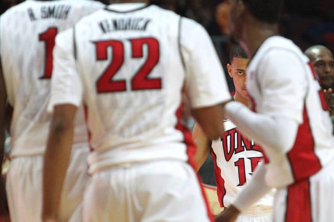 UNLV guard Kendall Smith waits for teammates to come to the bench for a time out during their Continental Tire Las Vegas Classic game against Santa Clara Sunday, Dec. 2013, at the Orleans Arena. UNLV won 92-71 and will face Mississippi State in the championship game Monday night.