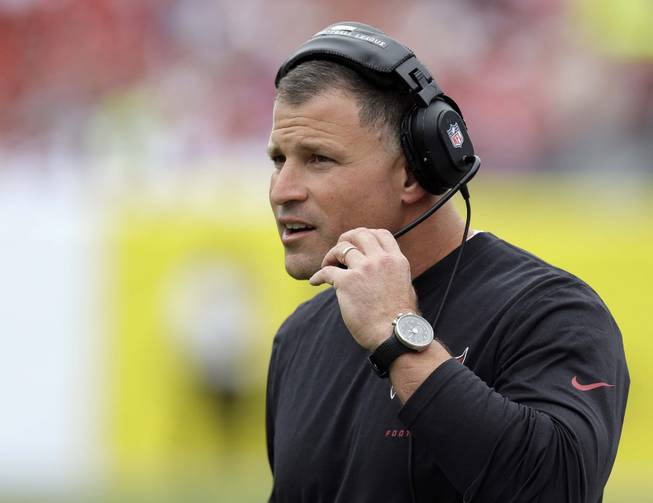 In a Sunday, Dec. 15, 2013, file photo, Tampa Bay Buccaneers head coach Greg Schiano watches during the first quarter of an NFL football game against the San Francisco 49ers, in Tampa, Fla. The Tampa Bay Buccaneers announced Monday, Dec. 30, 2013, that they have fired Schiano and general manager Mark Dominik following a 4-12 finish.