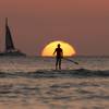 A paddle boarder looks out over the Pacific Ocean as the sun sets off Waikiki Beach, in Honolulu, on Tuesday, Dec. 31, 2013. A paddle boarder looks out over the Pacific Ocean as the sun sets off Waikiki Beach, in Honolulu, on Tuesday, Dec. 31, 2013.