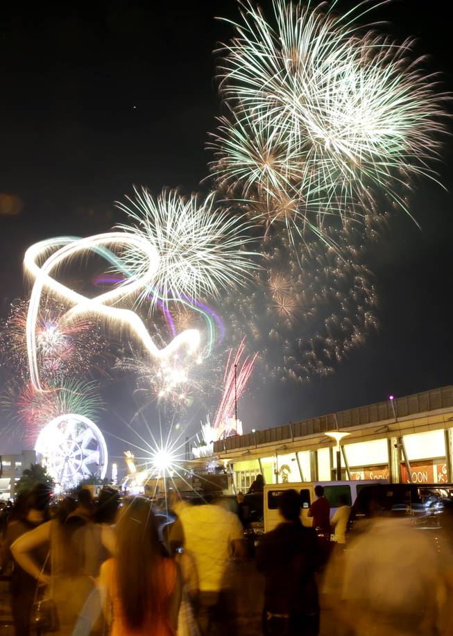 Fireworks light up the sky as Filipinos welcome the New Year Wednesday Jan. 1, 2014, in Manila, Philippines. Traditionally, Filipinos welcome the New Year with fireworks and firecrackers and making the loudest noise possible, including indiscriminate firing of their guns which sometimes result in injuries and deaths.