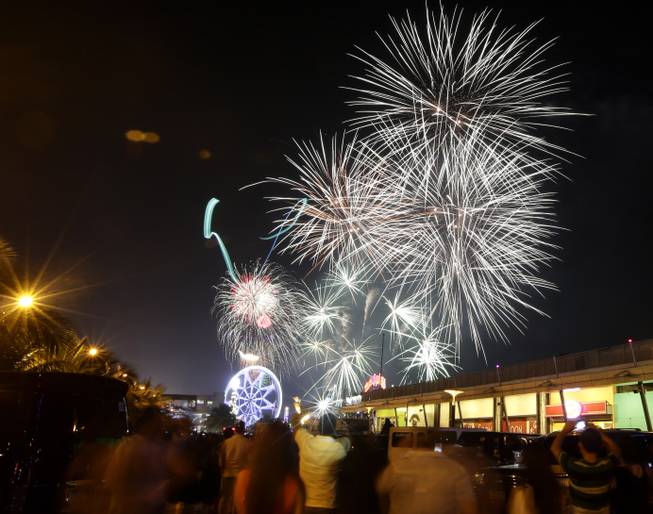 Fireworks light up the sky as Filipinos welcome the New Year Wednesday Jan. 1, 2014 in Manila, Philippines. Traditionally, Filipinos welcome the New Year with fireworks and firecrackers and making the loudest noise possible, including indiscriminate firing of their guns which sometimes result in injuries and deaths.