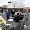 Photo: A small group of machinists union members are gree Photo: A small group of machinists union members are gree
