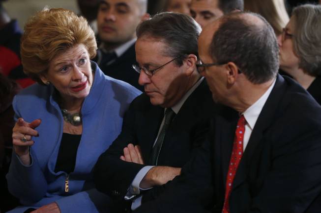 Sen. Debbie Stabenow, D-Mich., left, talks with White House National Economic Council Director Gene Sperling, center, as Labor Secretary Thomas Perez, right, before President Barack Obama spoke about benefits for the unemployed, Tuesday, Jan. 7, 2014, in the East Room at the White House in Washington.