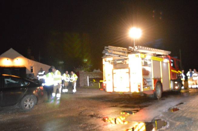 Emergency personnel respond to the scene at Salthouse, near to Cley-next-the-Sea, North Norfolk, where aU.S. Air Force HH-60G Pave Hawk helicopter, part of the 48th Air Wing based at RAF Lakenheath, crashed, killing four people onboard, during a training mission outside Cley-next-the-Sea on Tuesday, Jan. 7, 2014. (