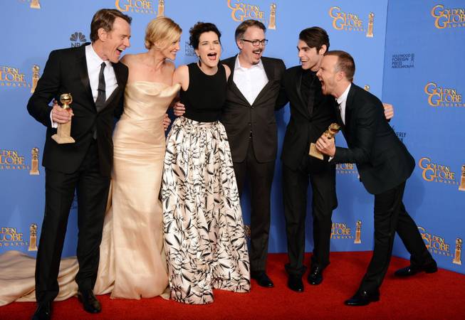 From left, Bryan Cranston, Anna Gunn, Betsy Brandt, Vince Gilligan, RJ Mitte, and Aaron Paul pose in the press room with the award for best tv series - drama for "Breaking Bad" at the 71st annual Golden Globe Awards at the Beverly Hilton Hotel on Sunday, Jan. 12, 2014, in Beverly Hills, Calif.
