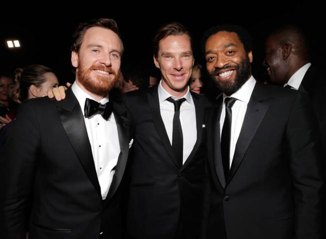From left, Michael Fassbender, Benedict Cumberbatch, and Steve McQueen winner of Best Motion Picture - Drama for '12 Years a Slave,' attend the FOX after party for the 71st Annual Golden Globes award show on Sunday, Jan. 12, 2014 in Beverly Hills, Calif.