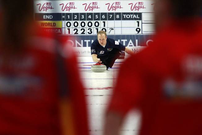 Gold medalist from the 2006 Olympics Mark Nichols releases a stone during the first day of the 2014 World Financial Group Continental Cup of Curling at the Orleans Arena Thursday, Jan. 16, 2014. Of the twelve teams competing from around the world, nine of them will represent their respective country at the upcoming Olympics in Sochi, Russia.