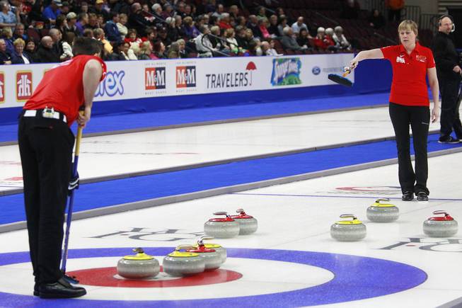 Sebastian Kraupp and Maria Prytz discuss strategy during their mixed doubles match on the first day of the 2014 World Financial Group Continental Cup of Curling at the Orleans Arena Thursday, Jan. 16, 2014. Of the twelve teams competing from around the world, nine of them will represent their respective country at the upcoming Olympics in Sochi, Russia.