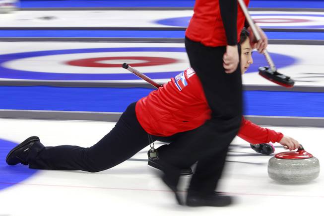 Satsuki Fujisawa releases a stone during the first day of the 2014 World Financial Group Continental Cup of Curling at the Orleans Arena Thursday, Jan. 16, 2014. Of the twelve teams competing from around the world, nine of them will represent their respective country at the upcoming Olympics in Sochi, Russia.