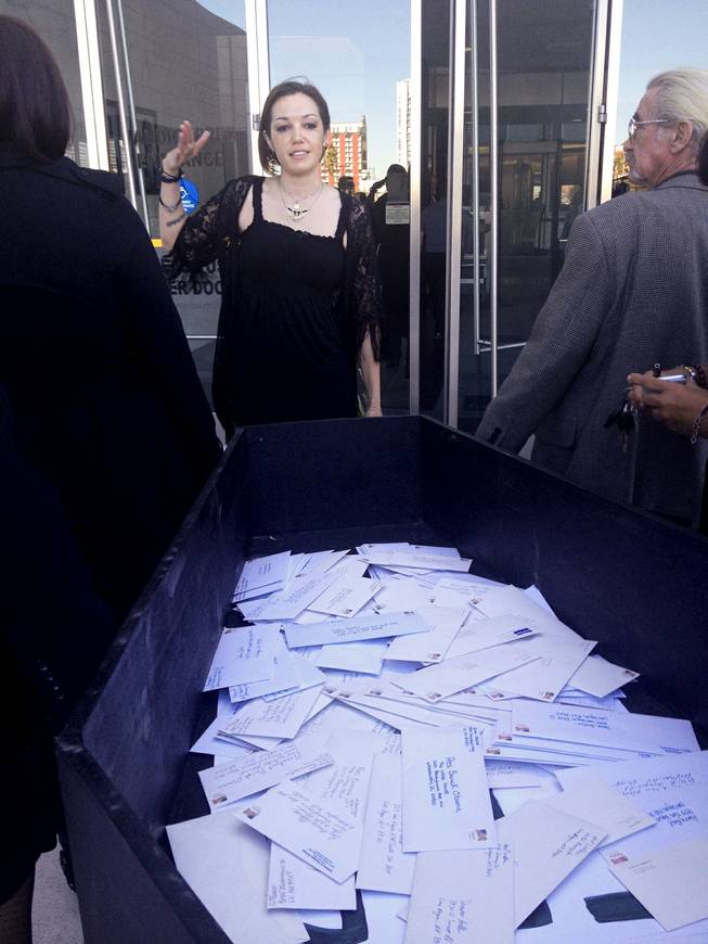 GMO-Free Las Vegas leader Angie Morelli deliveres 109 stamped envelopes with letters to Nevada's congressional delegation encouraging them not to support the controversial Trans-Pacific Partnership, a 12-nation trade agreement. The letters, placed in a coffin, arrived at the Lloyd D. George Federal Courthouse via a hearse on Thursday, Jan. 16, 2014.