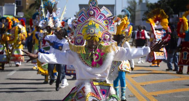 A member of a Caribbean carnival dance group marches in the MLK parade in Miami, Monday, Jan. 20, 2014. Dr. Martin Luther King, Jr. is honored across the country annually on the third Monday in January with Martin Luther King, Jr. Day. He was the most visible figure in the Civil Rights movement.
