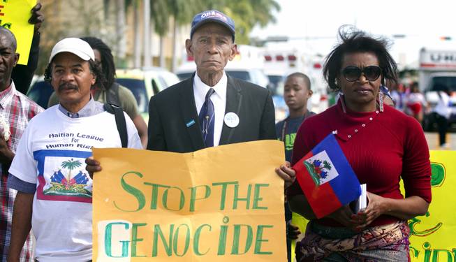 Members of the Haitian League of Human Rights demand that the Dominican Republic give Haitians living there more rights and protection during the MLK parade in Miami, Monday, Jan. 20, 2014. Dr. Martin Luther King, Jr. is honored across the country annually on the third Monday in January with Martin Luther King, Jr. Day.