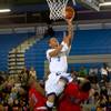 Photo: Canyon Springs' Gerad Davis lays up the ball for a Photo: Canyon Springs' Gerad Davis lays up the ball for a