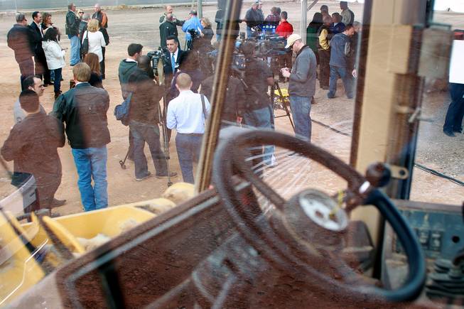 Governor Brian Sandoval is seen through a piece of heavy equipment as he talks to the media at an event to mark the beginning of construction of a Harley Davidson dealership on the Strip Thursday, Jan. 23, 2014. The dealership will be located on the east side of the Strip, just south of Russell Road.