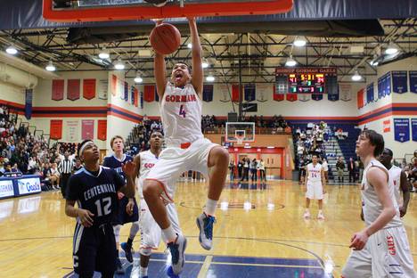Bishop Gorman forward Chase Jeter dunks on Centennial during their game Wednesday, Jan. 29, 2014. Bishop Gorman won the game 73-50.