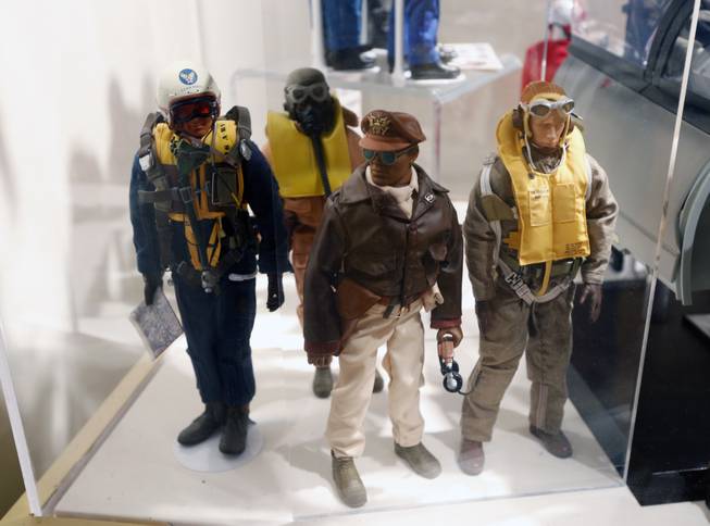This Jan. 31, 2014, photo shows Tuskegee Airmen G.I. Joe action figures in a display at the New York State Military Museum in Saratoga Springs, N.Y. A half-century after the 12-inch doll was introduced at a New York City toy fair, the iconic action figure is being celebrated by collectors with a display at the military museum, while the toy's maker plans other anniversary events to be announced later this month.