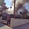 Photo: Flames erupted shortly after noon at this home in Photo: Flames erupted shortly after noon at this home in