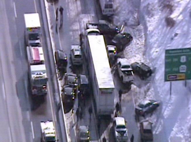This video frame grab provided by Fox 29 Philadelphia shows traffic accidents involving multiple tractor trailers and dozens of cars on Pennsylvania Turnpike outside Philadelphia, on Friday, Feb. 14, 2014. The crashes were reported just after 8 a.m. Friday, one day after the area got about a foot of snow that left roads slick. Television news helicopter footage showed several tractor-trailers and dozens of cars involved in a series of accidents that had backed up traffic for miles between the Bensalem and Willow Grove exits.