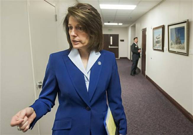 Nevada Attorney General Catherine Cortez Masto says the state is accepting $5.5 million from the former Lender Processing Services Inc., plus another $500,000 in attorney fees and costs, to settle a robosigning scheme involving the lender. Masto is shown in this file photo talking to media at the Legislative Building in Carson City, Nev., on May 29, 2013.