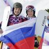 Russia's Vic Wild celebrates, after winning the gold medal in the men's snowboard parallel giant slalom final, with his wife and bronze medalist in the women's snowboard parallel giant slalom final, Russia's Alena Zavarzina, at Rosa Khutor Extreme Park at the 2014 Winter Olympics, Wednesday, Feb. 19, 2014, in Krasnaya Polyana, Russia. Russia's Vic Wild celebrates, after winning the gold medal in the men's snowboard parallel giant slalom final, with his wife and bronze medalist in the women's snowboard parallel giant slalom final, Russia's Alena Zavarzina, at Rosa Khutor Extreme Park at the 2014 Winter Olympics, Wednesday, Feb. 19, 2014, in Krasnaya Polyana, Russia.