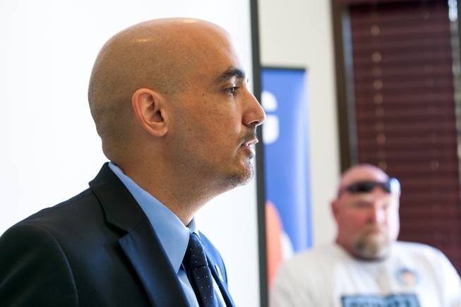 Joe Ferreira, president of Nevada Donor Network, speaks during a ceremony celebrating the life of 16-year-old Aric Michael Brill, who donated six organs following his homicide five years ago, at the UMC Transplant Center Friday, February 21, 2014. Don Brill, father of Aric Brill, listens from the side.