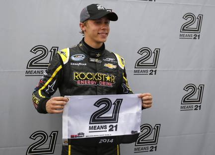Dylan Kwasniewski poses after winning the pole position during qualifying for the NASCAR Nationwide Series auto race at Daytona International Speedway in Daytona Beach, Fla., Friday, Feb. 21, 2014.