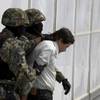 Joaquin "El Chapo" Guzman is escorted to a helicopter in handcuffs by Mexican navy marines at a navy hangar in Mexico City, Saturday, Feb. 22, 2014. A senior U.S. law enforcement official said Saturday that Guzman, the head of Mexico's Sinaloa Cartel, was captured alive overnight in the beach resort town of Mazatlan. Joaquin "El Chapo" Guzman is escorted to a helicopter in handcuffs by Mexican navy marines at a navy hangar in Mexico City, Saturday, Feb. 22, 2014. A senior U.S. law enforcement official said Saturday that Guzman, the head of Mexico's Sinaloa Cartel, was captured alive overnight in the beach resort town of Mazatlan.
