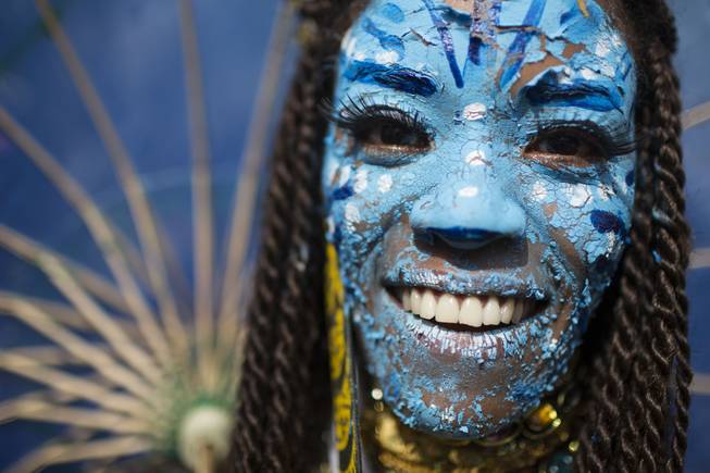 A reveler dressed as a character from the movie Avatar poses for a photo at the 'Ceu na Terra' block party during Carnival celebration in Rio de Janeiro, Brazil, Saturday, March 1, 2014. Rio de Janeiro's over-the-top Carnival is the highlight of the year for many local residents. Hundreds of thousands of merrymakers will take to Rio's streets in the nearly 500 open-air "bloco" parties.