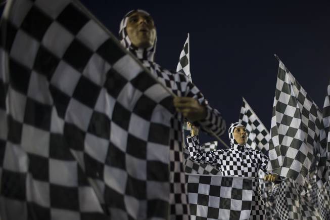Performers from the Unidos da Tijuca samba school parade during carnival celebrations at the Sambadrome in Rio de Janeiro, Brazil, Tuesday, March 4, 2014. Brazil's Carnival is maintaining its frenetic pace, with hundreds of roving parties taking over Rio de Janeiro's streets and famed samba school parades heading into their final night.