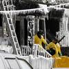 Photo: Officials exit from a home where a fire broke out Photo: Officials exit from a home where a fire broke out