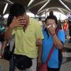 Photo: A woman wipes her tears after walking out of the r Photo: A woman wipes her tears after walking out of the r