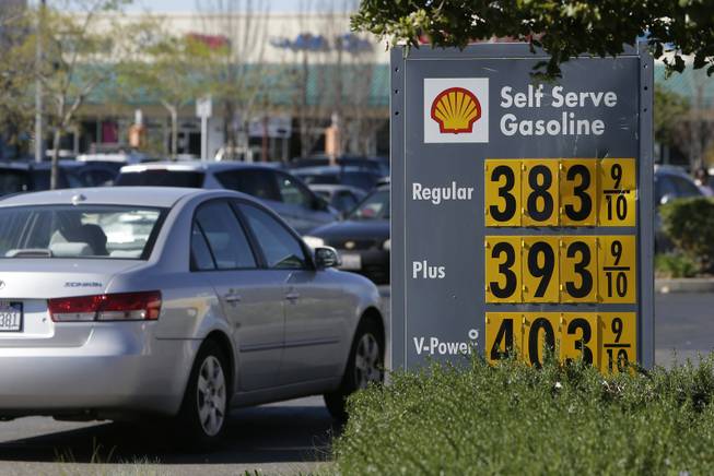 In this photo taken Friday, March 7, gas prices are displayed at a Shell station in Sacramento, Calif. Starting in 2015, California motorists will be hit in the pocketbook by the state's greenhouse gas reduction law, AB32. Signed into law by Gov. Arnold Schwarzenegger in 2006, AB32 will force fuel distributors into the same cap-and-trade marketplace as utilities and major manufacturers. The oil industry says it will lead to price increase of at least 12 cents a gallon immediately, while state regulators say any price spikes could vary widely, from barely noticeable to double-digits.