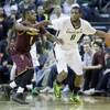 Oregon forward Mike Moser, right, dribbles against Arizona State guard Jahii Carson during the second half of an NCAA college basketball game in Eugene, Ore., Tuesday, March 4, 2014. Moser led Oregon with 22 points and 17 rebounds as they beat Arizona State 85-78. Oregon forward Mike Moser, right, dribbles against Arizona State guard Jahii Carson during the second half of an NCAA college basketball game in Eugene, Ore., Tuesday, March 4, 2014. Moser led Oregon with 22 points and 17 rebounds as they beat Arizona State 85-78.