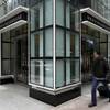 Photo: People walk by a Men's Wearhouse store, in New Yor Photo: People walk by a Men's Wearhouse store, in New Yor