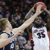 Photo: Gonzaga's Sam Dower Jr. (35) puts up a shot agains Photo: Gonzaga's Sam Dower Jr. (35) puts up a shot agains