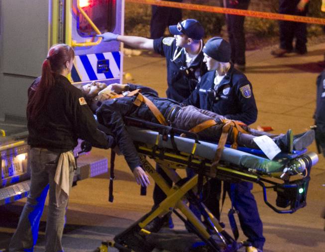 A man is transported to an ambulance after being struck by a vehicle on Red River Street in downtown Austin, Texas, on Wednesday March 12, 2014. Police say two people were confirmed dead at the scene after a car drove through temporary barricades set up for the South By Southwest festival and struck a crowd of pedestrians. The condition of the man is unknown.