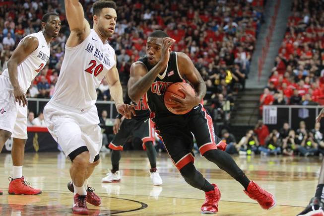 UNLV forward Roscoe Smith makes his move to the basket while being defended by San Diego State forward J.J. O'Brien during their Mountain West Conference semifinal game Friday, March 14, 2014 at the Thomas & Mack Center. The #8 ranked San Diego State Aztecs won 59-51 to advance to the finals.