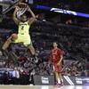 Baylor's Rico Gathers (2) scores as Nebraska's Shavon Shields (31) looks on during the first half of a second-round game in the NCAA college basketball tournament Friday, March 21, 2014, in San Antonio. Baylor's Rico Gathers (2) scores as Nebraska's Shavon Shields (31) looks on during the first half of a second-round game in the NCAA college basketball tournament Friday, March 21, 2014, in San Antonio.
