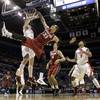 New Mexico's Cameron Bairstow, left, blocks a shot by Stanford's Dwight Powell (33) during the first half of a second-round game in the NCAA college basketball tournament, Friday, March 21, 2014, in St. Louis. New Mexico's Cameron Bairstow, left, blocks a shot by Stanford's Dwight Powell (33) during the first half of a second-round game in the NCAA college basketball tournament, Friday, March 21, 2014, in St. Louis.