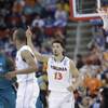 Virginia forward Anthony Gill (13) celebrates a Virginia goal against Coastal Carolina during the second half of an NCAA college basketball second-round tournament game, Friday, March 21, 2014, in Raleigh. Virginia forward Anthony Gill (13) celebrates a Virginia goal against Coastal Carolina during the second half of an NCAA college basketball second-round tournament game, Friday, March 21, 2014, in Raleigh.