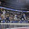 Memphis guard Michael Dixon Jr. (11) shoots against George Washington guard Miguel Cartagena (3) during the second half of an NCAA college basketball second-round tournament game Friday, March 21, 2014, in Raleigh, N.C. Memphis guard Michael Dixon Jr. (11) shoots against George Washington guard Miguel Cartagena (3) during the second half of an NCAA college basketball second-round tournament game Friday, March 21, 2014, in Raleigh, N.C.