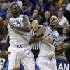 Kentucky's Julius Randle, left, pulls down a rebound as teammate Willie Cauley-Stein (15) and Kansas State's Thomas Gipson, right, watch during the second half of a second-round game in the NCAA college basketball tournament Friday, March 21, 2014, in St. Louis. Kentucky won 56-49. Kentucky's Julius Randle, left, pulls down a rebound as teammate Willie Cauley-Stein (15) and Kansas State's Thomas Gipson, right, watch during the second half of a second-round game in the NCAA college basketball tournament Friday, March 21, 2014, in St. Louis. Kentucky won 56-49.